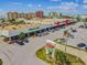 Aerial view of a commercial center featuring stores like Dollar Tree and Winn-Dixie, with ample parking at 315 Medallion Blvd # E, Madeira Beach, FL 33708
