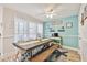 Charming dining area with a coffee bar, large windows with sheer curtains, and a wooden table with bench seating at 315 Medallion Blvd # E, Madeira Beach, FL 33708