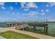 Waterfront community dock offering access to the water and boat tie ups at 315 Medallion Blvd # E, Madeira Beach, FL 33708