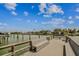 Scenic view from the community dock with seating and lovely water views at 315 Medallion Blvd # E, Madeira Beach, FL 33708