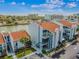 Aerial view of a condo complex with a waterfront view and private boat slips and docks at 315 Medallion Blvd # E, Madeira Beach, FL 33708