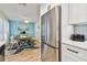 This kitchen provides stainless steel refrigerator and a dining area with plenty of room at 315 Medallion Blvd # E, Madeira Beach, FL 33708