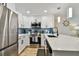 The updated kitchen features stainless appliances, white cabinets, and a modern backsplash at 315 Medallion Blvd # E, Madeira Beach, FL 33708