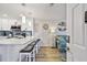 Modern kitchen with a breakfast bar, white cabinets, and stainless steel appliances at 315 Medallion Blvd # E, Madeira Beach, FL 33708