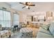 Open-concept living room with a view into the kitchen, perfect for entertaining at 315 Medallion Blvd # E, Madeira Beach, FL 33708