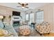 Cozy living room with a fireplace and beachy decor, creating a relaxing atmosphere at 315 Medallion Blvd # E, Madeira Beach, FL 33708