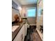 A modern bathroom with double sinks, sleek countertops, and a glass-enclosed shower at 3217 W Lawn Ave, Tampa, FL 33611