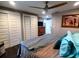 A large bedroom with an airy feel features a ceiling fan and plenty of storage at 3217 W Lawn Ave, Tampa, FL 33611