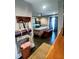 The main bedroom boasts ample space, a ceiling fan, and French doors that lead to the exterior at 3217 W Lawn Ave, Tampa, FL 33611
