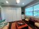 A bedroom with a cozy seating area and plenty of natural light at 3217 W Lawn Ave, Tampa, FL 33611