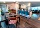 Open concept kitchen with white cabinets, stainless appliances, large island, and dining area at 3217 W Lawn Ave, Tampa, FL 33611