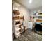 This laundry room features a sink with lots of decorations and signs surrounding the appliances at 3217 W Lawn Ave, Tampa, FL 33611