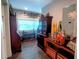Office with a lot of storage units and desk space under natural light from the windows at 3217 W Lawn Ave, Tampa, FL 33611