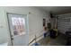 Garage with pegboard, exterior access door, and roll-up door at 3527 Greenglen Cir, Palm Harbor, FL 34684