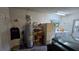 Functional garage with laundry area, shelving, and hot water tank at 3527 Greenglen Cir, Palm Harbor, FL 34684