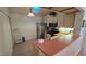 A bright kitchen featuring stainless steel appliances and a tile floor at 3527 Greenglen Cir, Palm Harbor, FL 34684