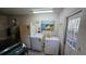Laundry room with washer, dryer, and utility sink at 3527 Greenglen Cir, Palm Harbor, FL 34684