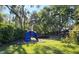 Community playground featuring climbing structure, swings, and sandbox at 3527 Greenglen Cir, Palm Harbor, FL 34684