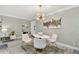 Dining area with a modern light fixture, round table, and contemporary decor at 36750 Us 19 N # 20211, Palm Harbor, FL 34684