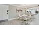 Charming dining area next to the kitchen with a modern light fixture and contemporary decor at 36750 Us 19 N # 20211, Palm Harbor, FL 34684