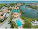 Scenic aerial view of waterfront community featuring pool, tennis courts, and convenient boat access at 4316 Sunray Ct # 34, Tampa, FL 33615