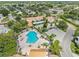 Aerial view of community pool, lounge area, and canal-front residences at 4316 Sunray Ct # 34, Tampa, FL 33615