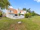Townhome backyard with a white picket fence and lush green grass at 4316 Sunray Ct # 34, Tampa, FL 33615