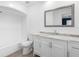 Bright bathroom with a shower and tub combination, white vanity, and a framed mirror at 4316 Sunray Ct # 34, Tampa, FL 33615
