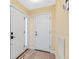 Inviting entryway featuring beautiful flooring, a bright front door, and neutral wall colors at 4316 Sunray Ct # 34, Tampa, FL 33615