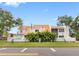 A two-story townhome with a distinctive copper roof and verdant privacy landscaping at 4316 Sunray Ct # 34, Tampa, FL 33615
