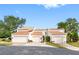 Full front view of the townhomes including the driveways and manicured landscaping at 4316 Sunray Ct # 34, Tampa, FL 33615