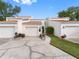 Charming townhome featuring a private garage, well-maintained landscaping, and a welcoming entryway at 4316 Sunray Ct # 34, Tampa, FL 33615