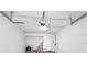 Spacious garage with white concrete block walls, an automatic door opener, and ample room for storage at 4316 Sunray Ct # 34, Tampa, FL 33615