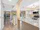 Bright open-concept kitchen with granite countertops, stainless steel appliances, and wood-look flooring at 4316 Sunray Ct # 34, Tampa, FL 33615