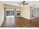 Bright living room with fireplace, sliding doors to outside and luxury vinyl plank flooring at 4316 Sunray Ct # 34, Tampa, FL 33615