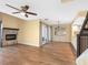 Spacious living room featuring a fireplace, dining area, and luxury vinyl plank flooring at 4316 Sunray Ct # 34, Tampa, FL 33615