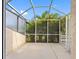 Enclosed patio with ample space and lush greenery, perfect for outdoor entertaining at 4316 Sunray Ct # 34, Tampa, FL 33615