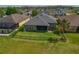 View of a fenced backyard and screened lanai, perfect for outdoor living and entertaining at 4839 Pointe O Woods Dr, Wesley Chapel, FL 33543