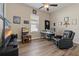 Multipurpose bedroom with home theater setup, desk, and comfortable leather recliner for relaxing at 4839 Pointe O Woods Dr, Wesley Chapel, FL 33543