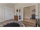 Charming office space with french doors, tile floors, a dresser, and piano at 4839 Pointe O Woods Dr, Wesley Chapel, FL 33543