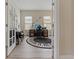 Stylish office with a unique keyboard rug, desk, and a piano at 4839 Pointe O Woods Dr, Wesley Chapel, FL 33543