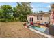 Backyard featuring a patio area with outdoor seating and a view of the pond at 5050 68Th N Way, St Petersburg, FL 33709