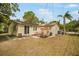 Backyard featuring a patio area with outdoor seating at 5050 68Th N Way, St Petersburg, FL 33709