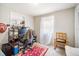 Cozy bedroom with a desk, built-in shelving, and a window at 5050 68Th N Way, St Petersburg, FL 33709