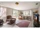 Comfortable living room with bright light, leading to a fenced backyard at 5050 68Th N Way, St Petersburg, FL 33709