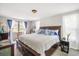 Spacious bedroom with large bed, blue accents, and plenty of natural light at 5050 68Th N Way, St Petersburg, FL 33709