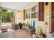 Charming porch with a variety of plants and decorative features at 5050 68Th N Way, St Petersburg, FL 33709