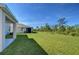 Lush lawn extends to wooded backdrop at 5325 Thistle Field Ct, Wesley Chapel, FL 33545