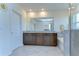 Bathroom featuring double vanity, bathtub and tile flooring with glass shower at 5325 Thistle Field Ct, Wesley Chapel, FL 33545