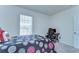 Bedroom featuring a bed, desk, and window with natural light at 5325 Thistle Field Ct, Wesley Chapel, FL 33545